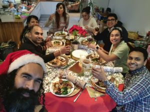 Vishal and a group of friends and family on Christmas day eating Christmas lunch