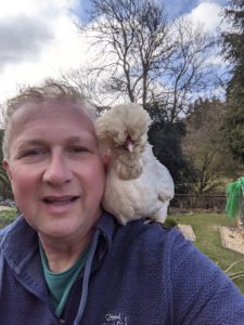 Scott with a chicken on his shoulder
