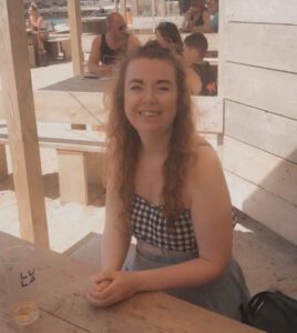 Caroline smiling at the camera.