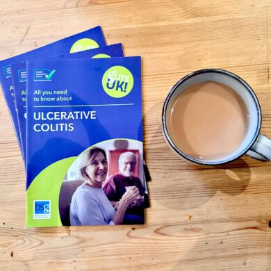 A selection of Guts UK patient information leaflets are on a table next to a cup of tea.