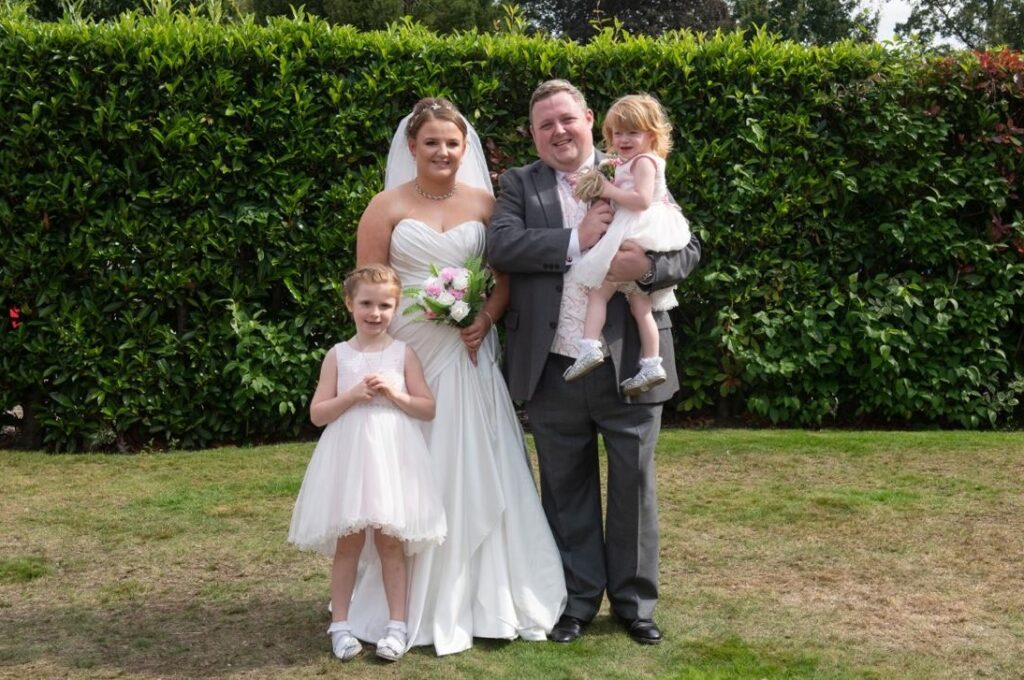 Gareth on his wedding day with his wife Sam and members of his family