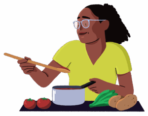 Guts UK brand cartoon character of a woman cooking. She is raising a wooden spoon from the pan to taste the food and there are various vegetables in front of her. She is smiling and wears a green V-neck top.