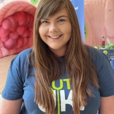 Diane Brassett, Communications Manager in a Guts UK t-shirt.