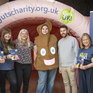 A group of people stand in front of