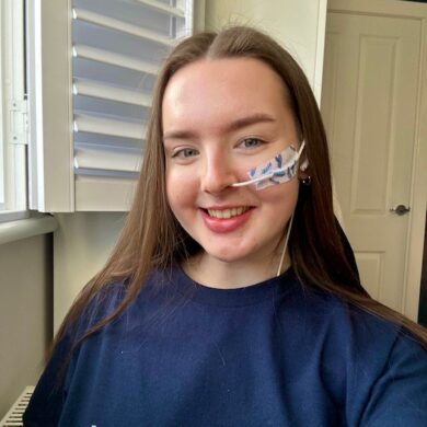 Guts UK supporter Lucy smiling at the camera.