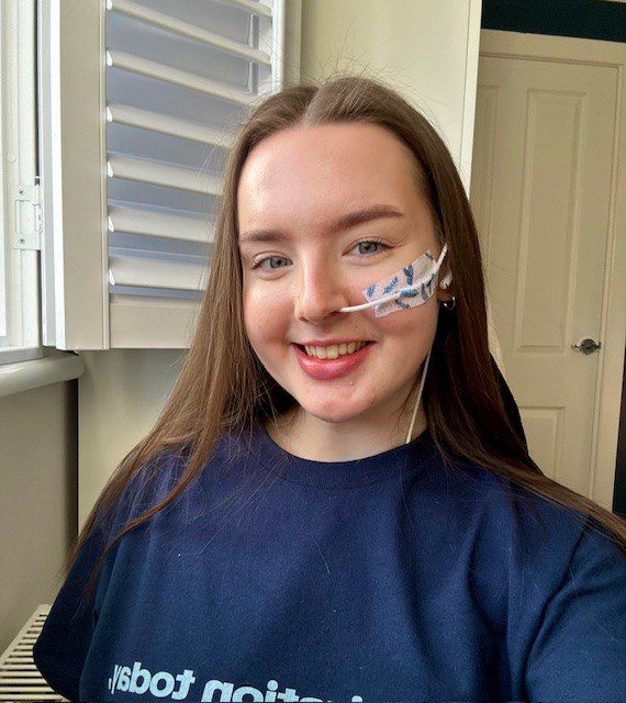 Guts UK supporter Lucy smiling at the camera. 