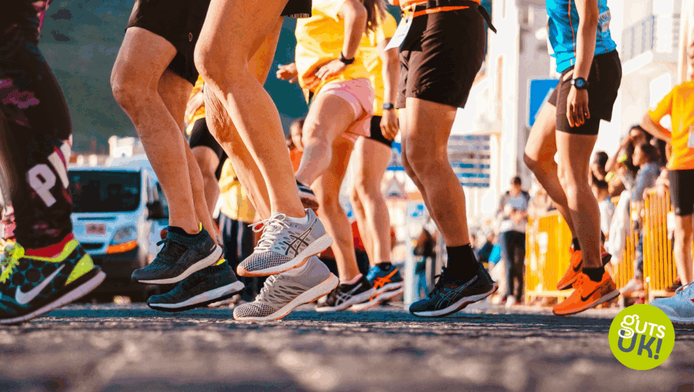 the legs and feet of a group of runners getting ready for a race.