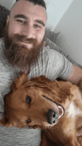 Sean pictured with his dog, a golden Labrador called Micky.