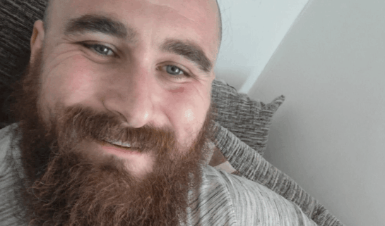 Sean pictured with his dog, a golden Labrador called Micky.