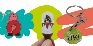 Different products available on the Guts UK online shop including a gut keyring, poo pen and Guts UK trolley token.