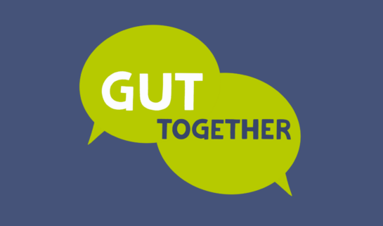 Two green speech bubbles overlapped with have the words 'Gut Together' inside in white and blue text, over a blue background.